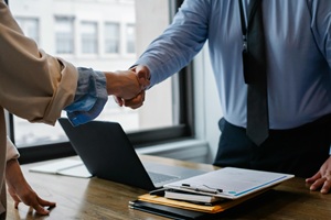 Business partners shaking hands.